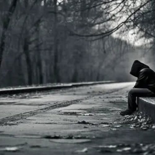 pngtree-lonely-hooded-man-sitting-on-pavement-in-a-black-area-image_2576885